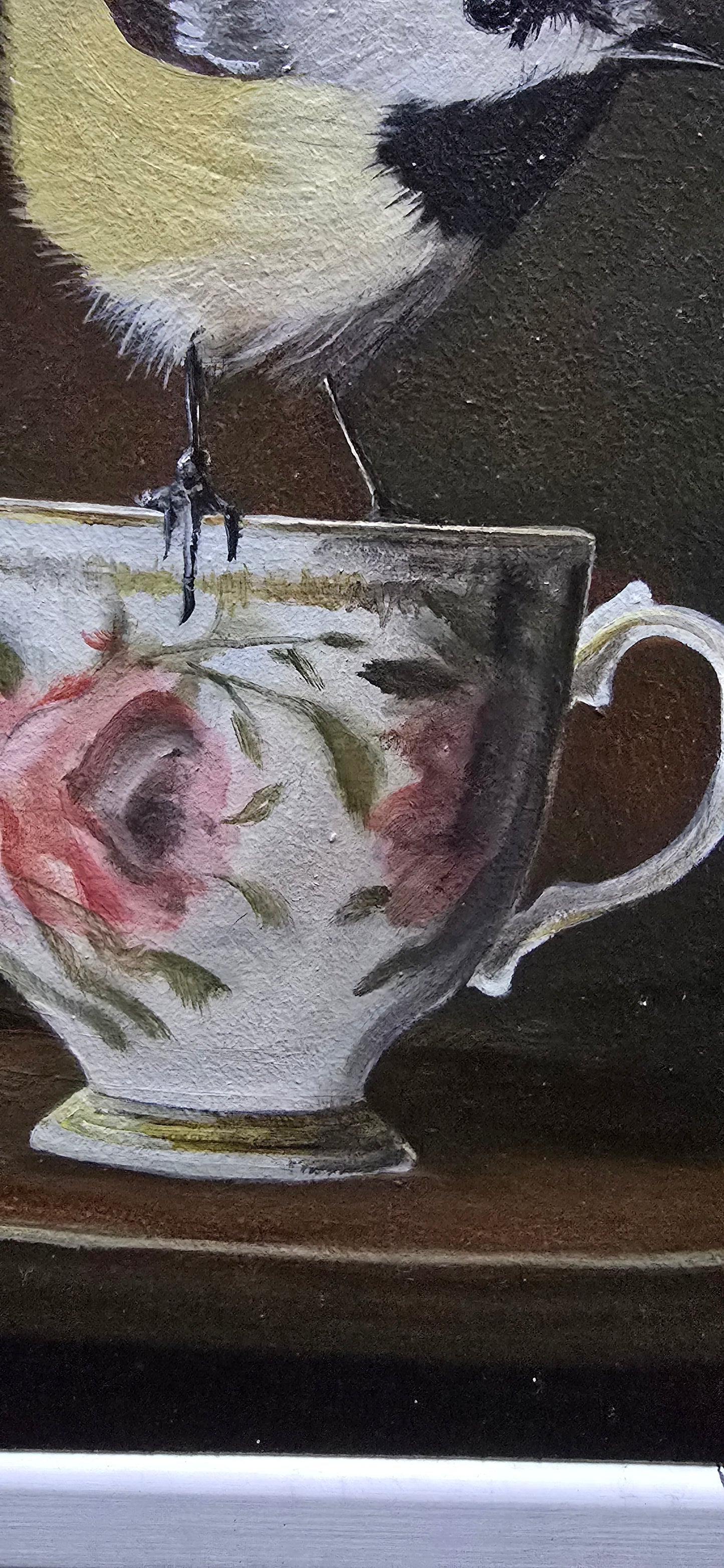 Brid on teacup